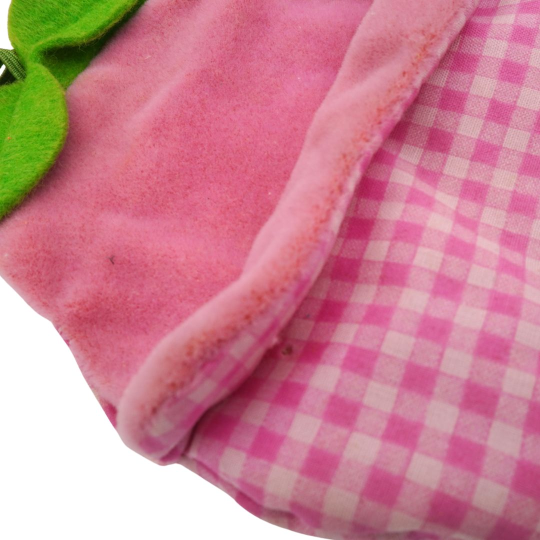 Close-up of pink fleece fabric with a checkered pattern