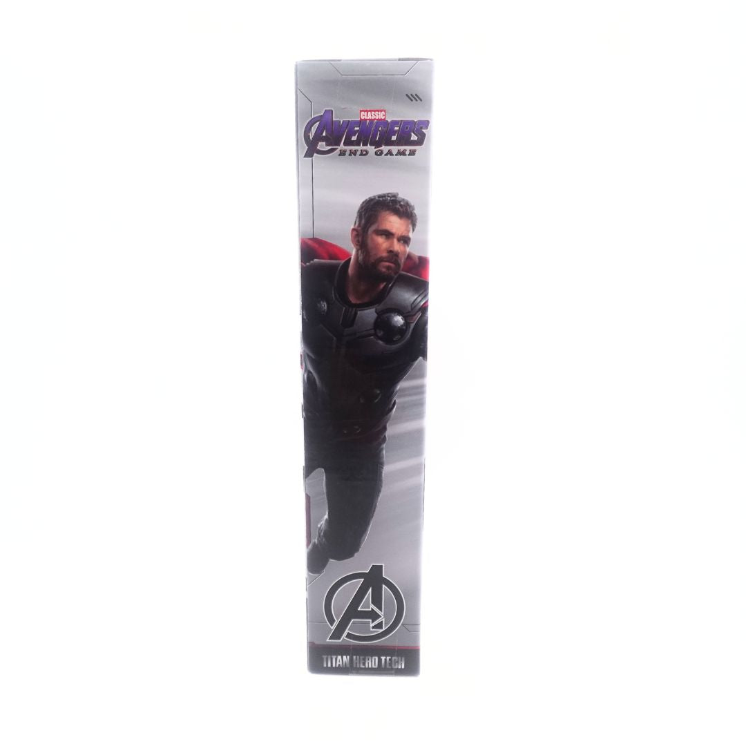 Side on photo of the cardboard packaging of a Thor Avengers Endgame figurine with a photo of Chris Hemsworth