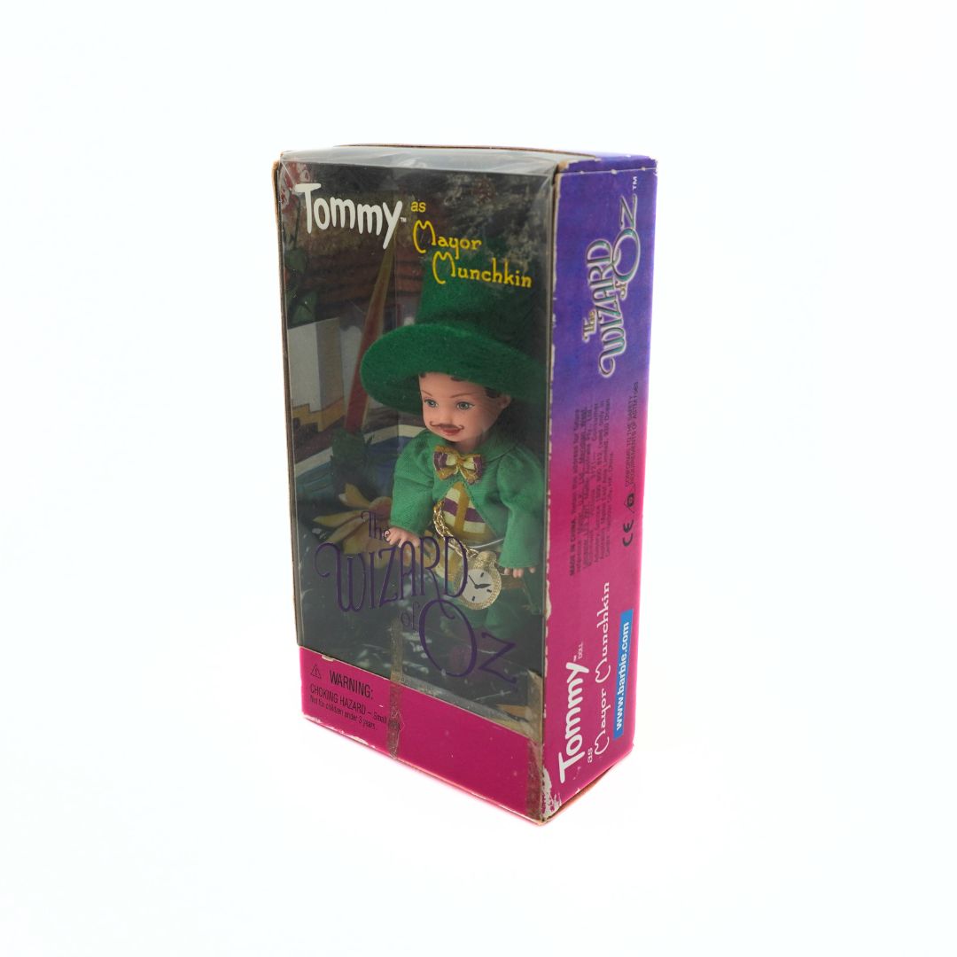 1999 Barbie Mattel Tommy as Mayor Munchkin doll in a green outfit, still in its original packaging