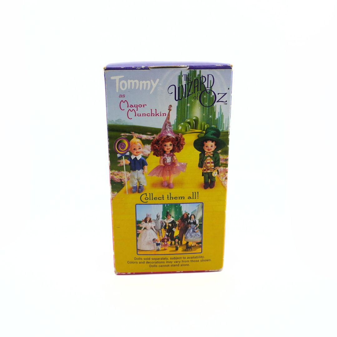 Back of a Wizard of Oz Barbie Tommy as Mayor Munchkin packaging, showing the other dolls in the collection