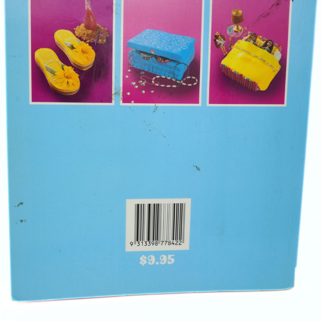 Product packaging with colorful illustrations and a barcode on a blue background showing some marks