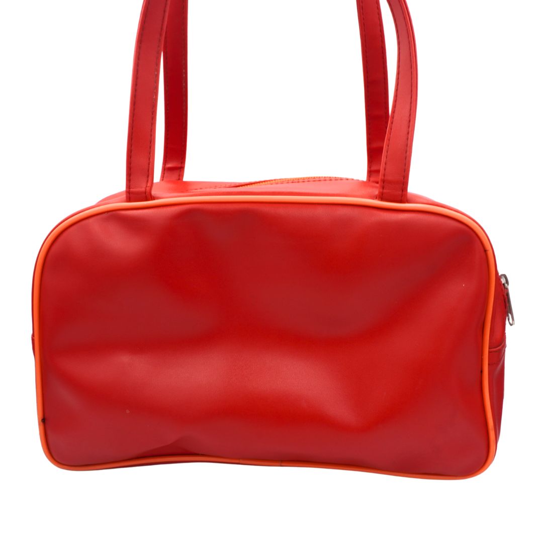 Back of a vintage Y2K Tweety Bird bag with a red and orange colour palette