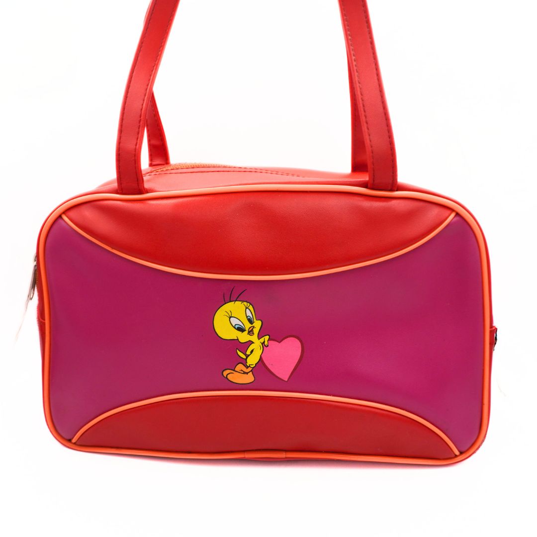A pink and red Y2K era Tweety Bird bowling bag with fixed top handles