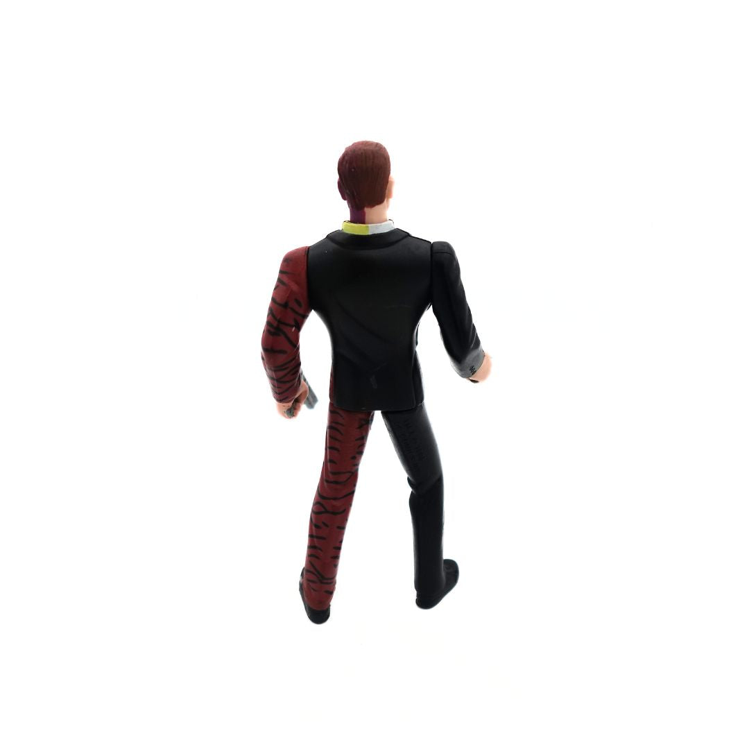 Back of the 1995 Tommy Lee Jones Batman Forever Two-Face figurine with a half black suit and half zebra print suit