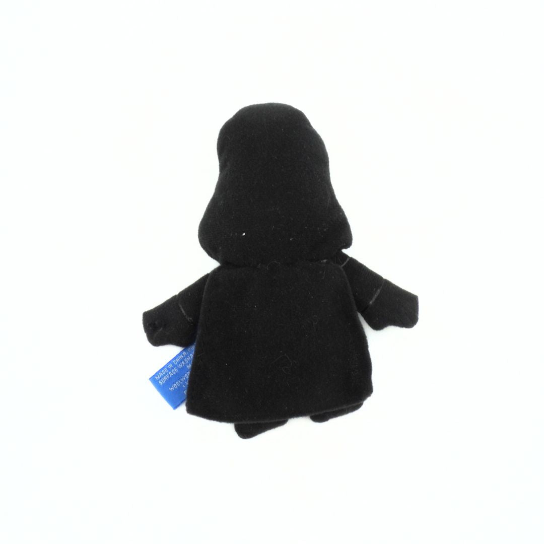 Black plush toy with a hood on a white background
