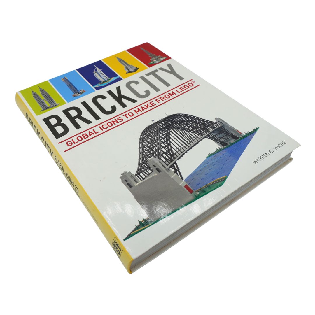 Front cover of the book Brick City photographed on a white background with green, blue, yellow and red details