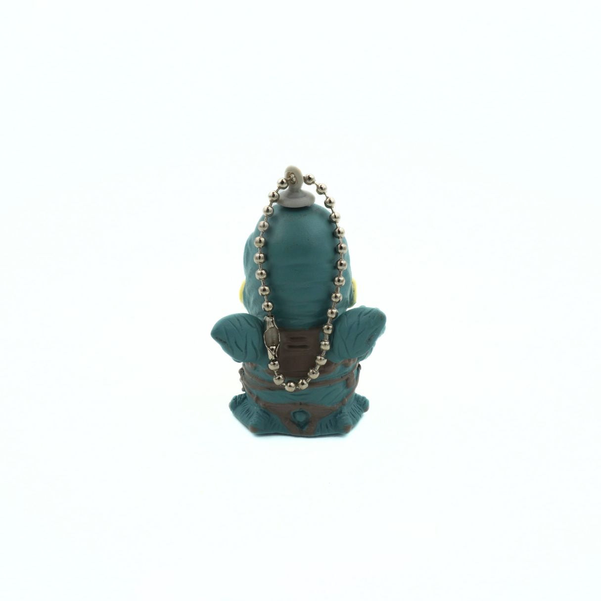 Back of a 90s Star Wars keyring of the character Watto, with a chibi design