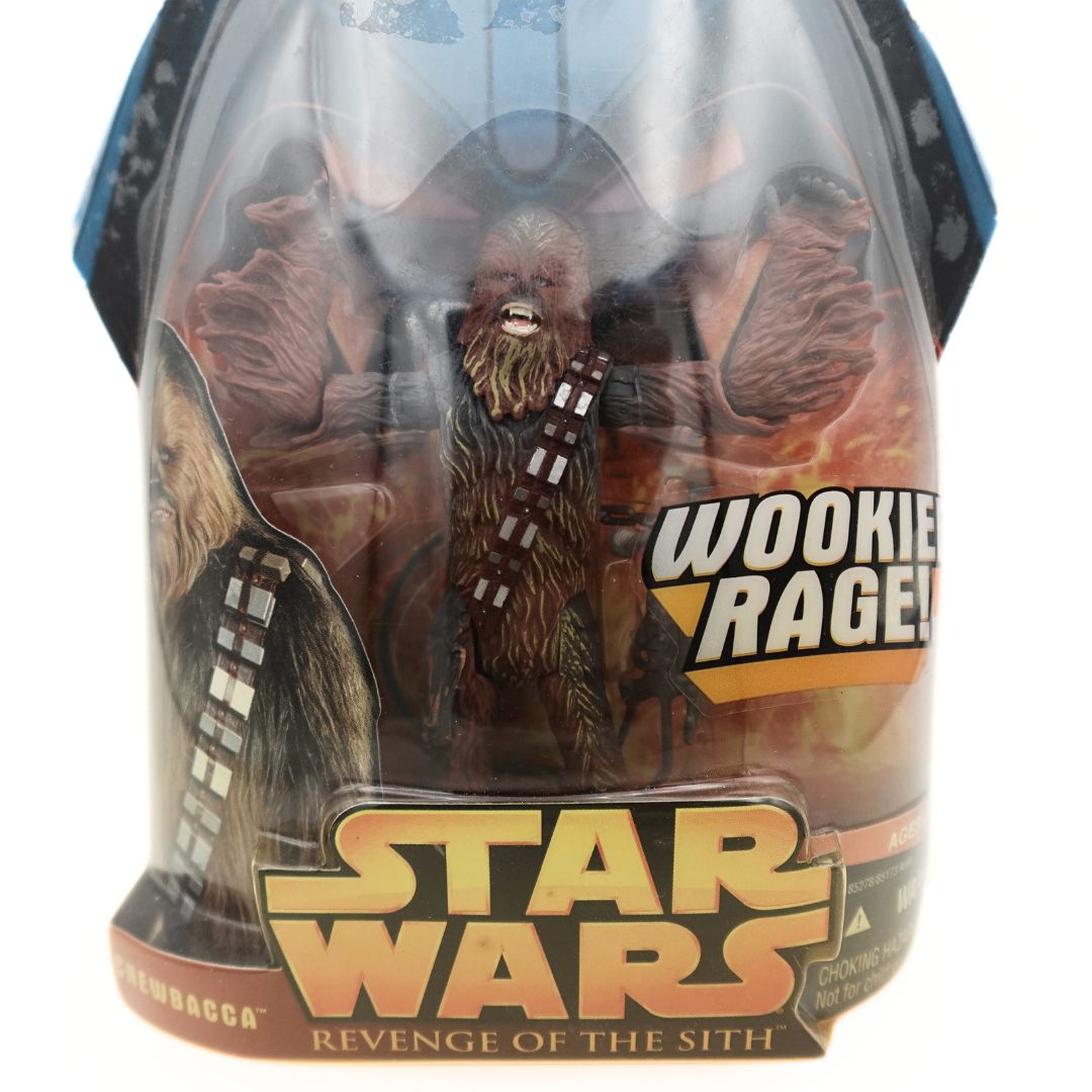Closeup of Chewbacca inside the Wookie Rage Star Wars Revenge of the Sith Packaging with his arms in the air
