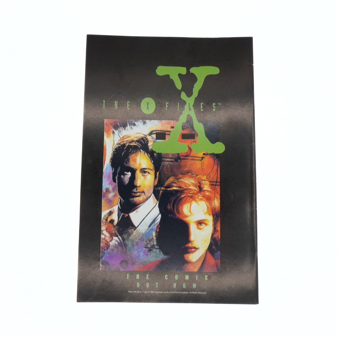 Poster for 'The X-Files' with characters and logo on a black background