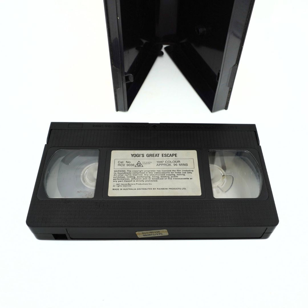 Top down image of the vintage clamshell case of Yogis Great Escape