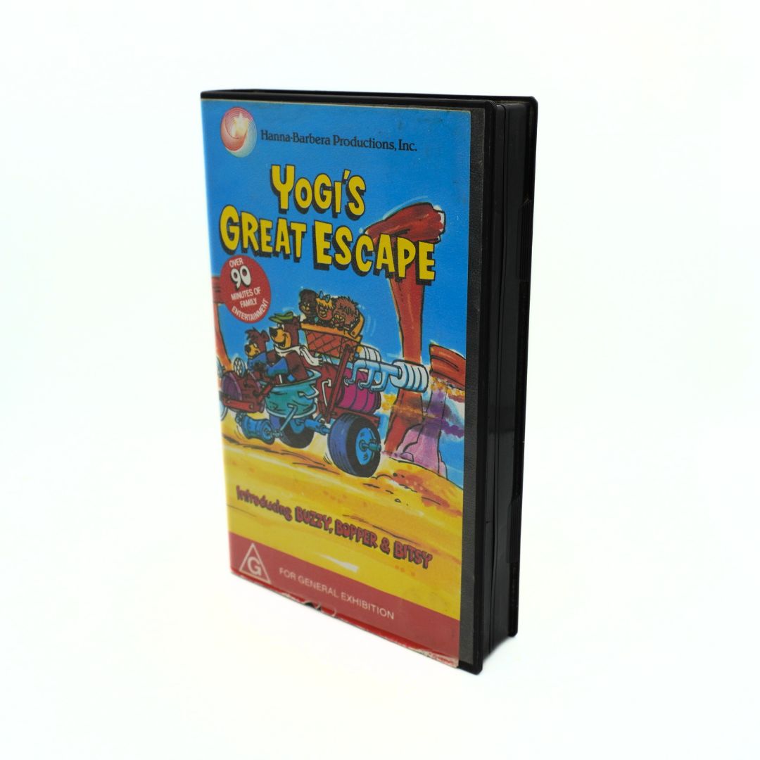 VHS tape of the made-for-TV film Yogi's Great Escape in its blue, yellow, red and black clamshell case
