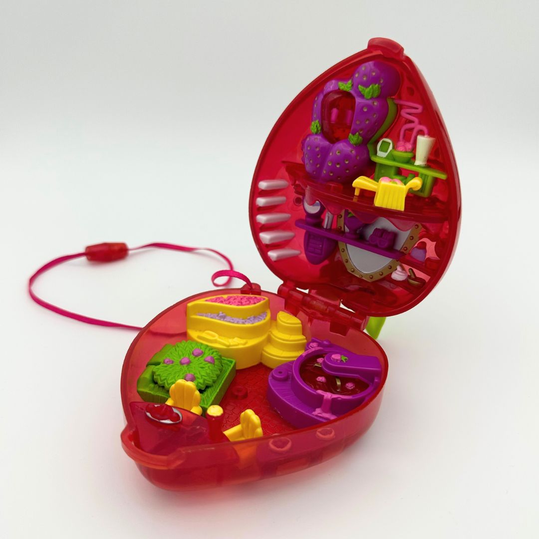 Strawberry Polly Pocket opened to display the colourful interior