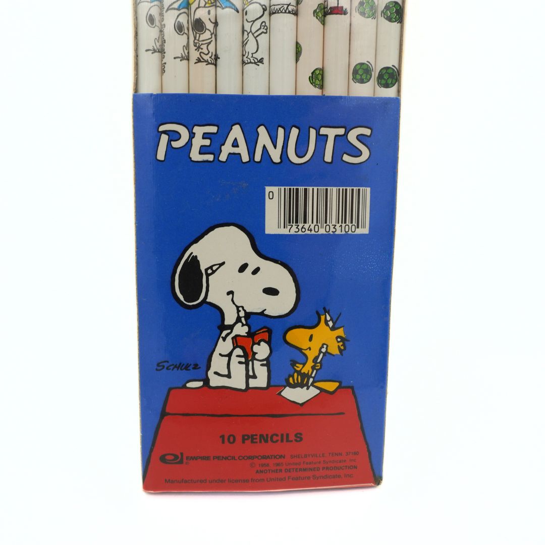 Box of Peanuts-themed pencils with Snoopy and Woodstock on a blue background