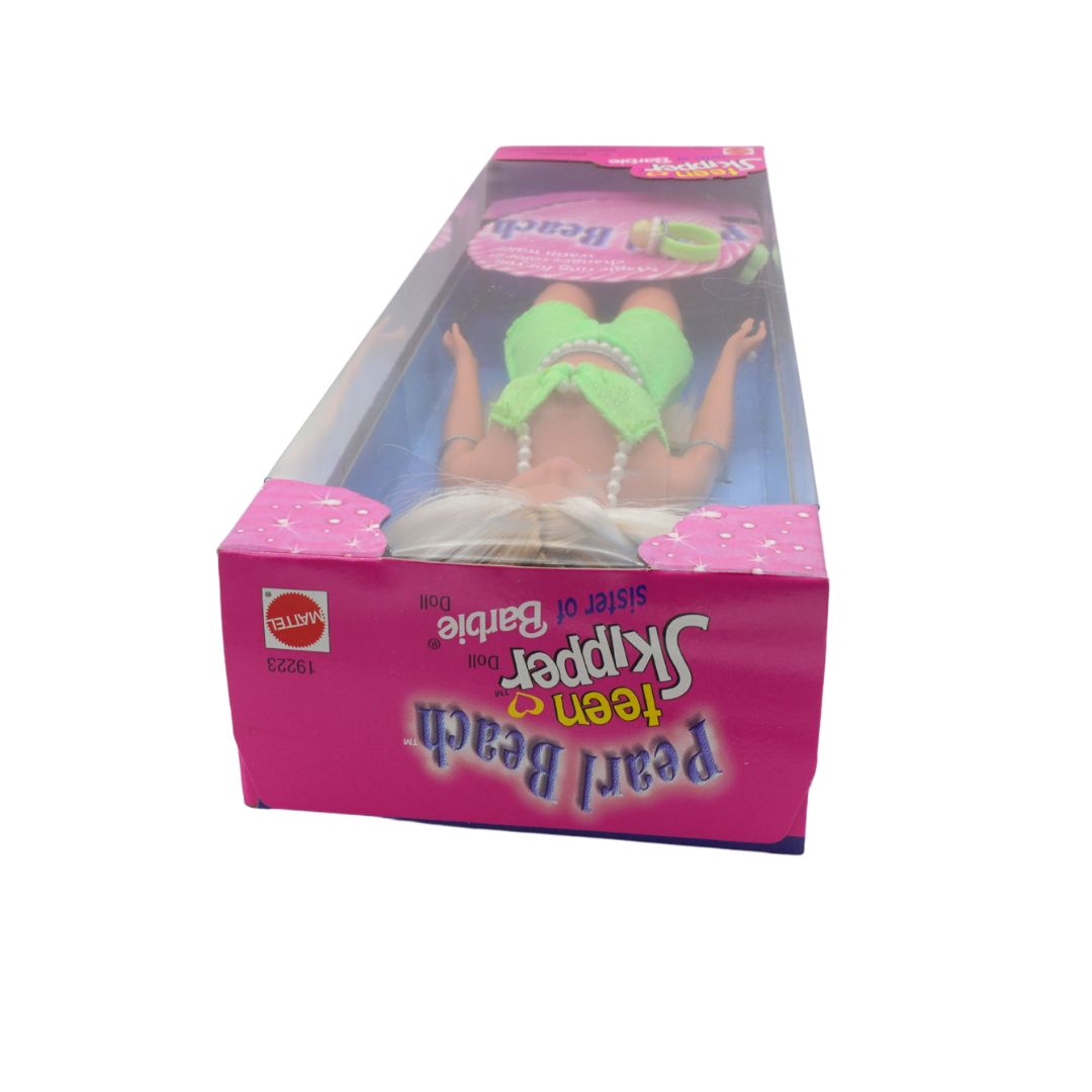 Toy packaging with a character wearing a green hat and pearl necklace on a white background