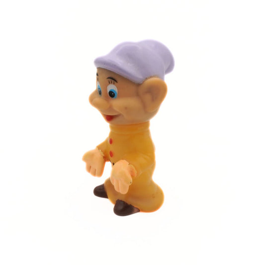 Toy figure of a character with a purple hat on a white background