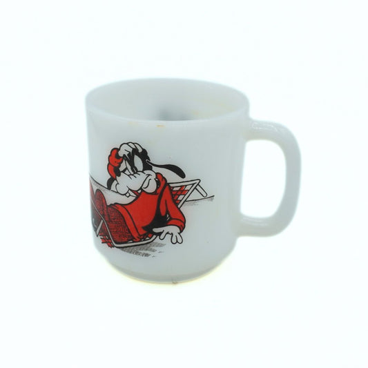 White mug with cartoon character design on a white background