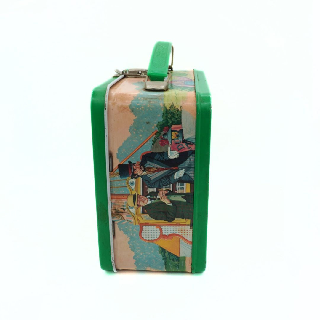 Colorful vintage-style lunch box with a green handle on a white background