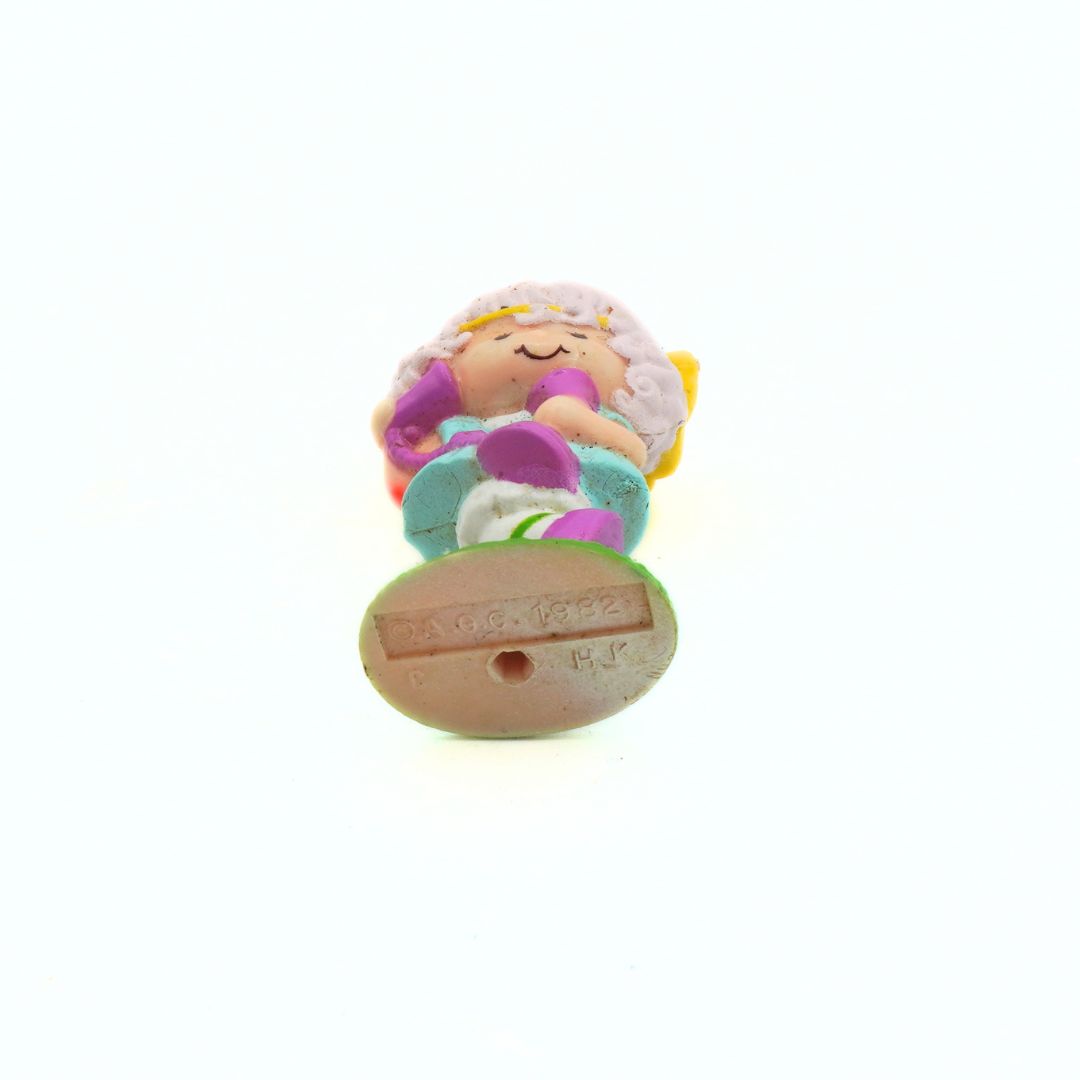 Colorful mermaid figurine on a white background