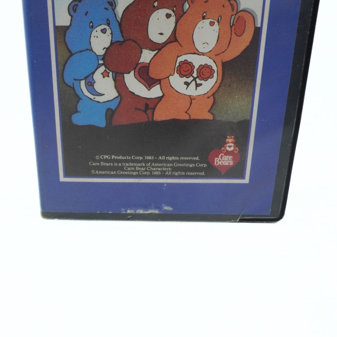 Care Bears illustration on a blue background with Care Bears logo.