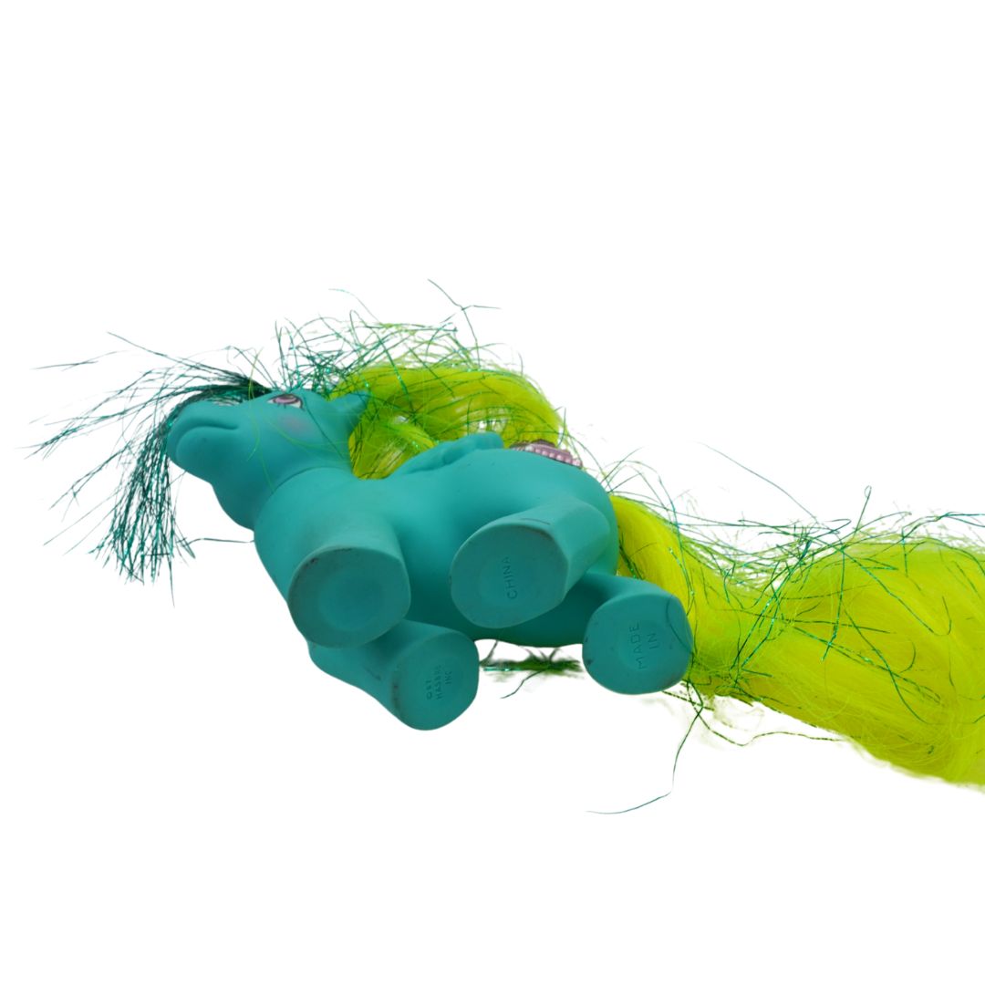 Teal My Little Pony toy with a green and yellow colour palette