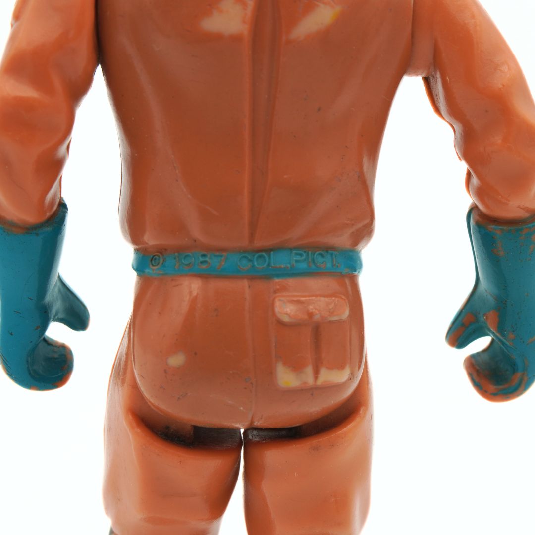 Close-up of a figure in an orange suit with blue gloves on a white background