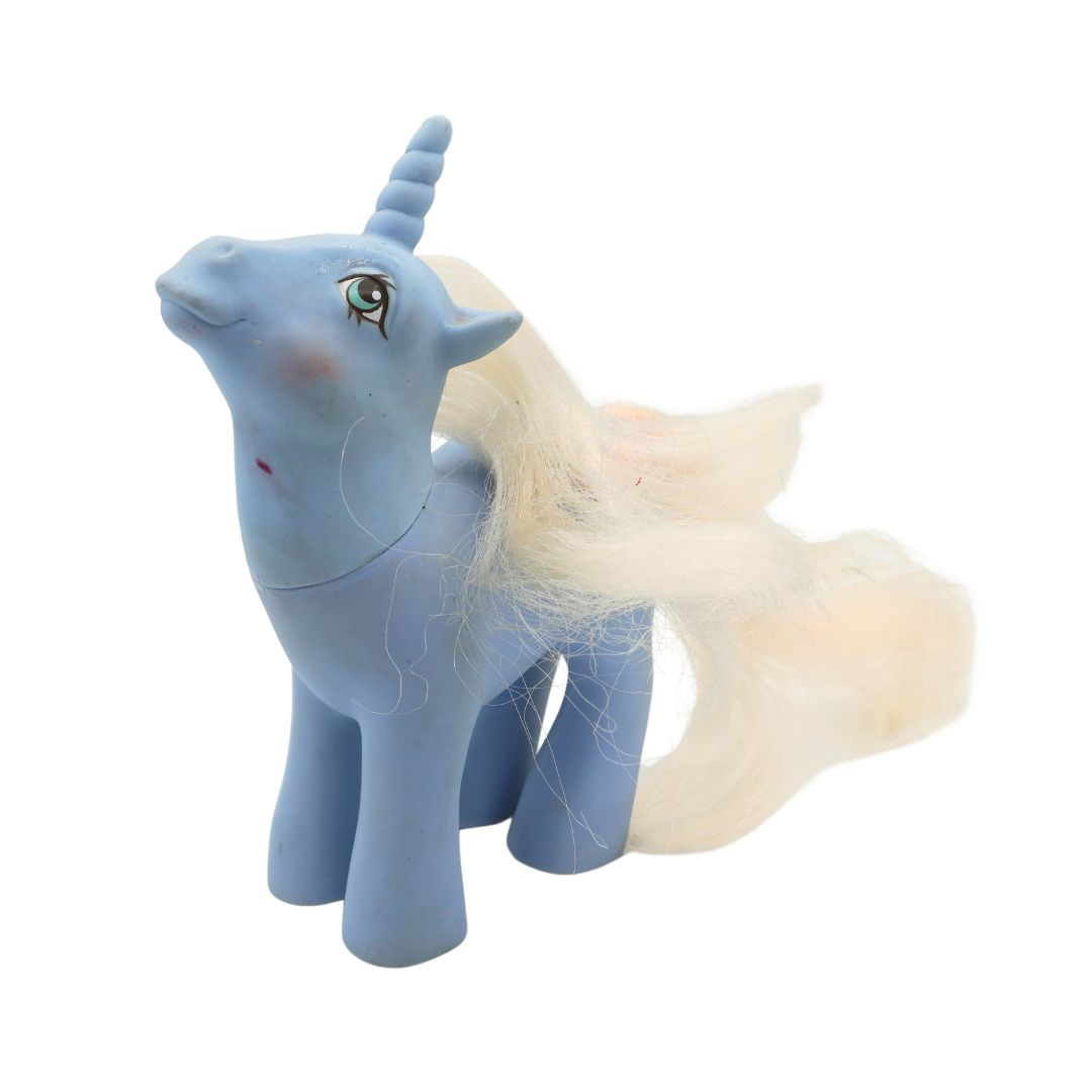 A blue My Little Pony unicorn with light blonde hair and green eyes