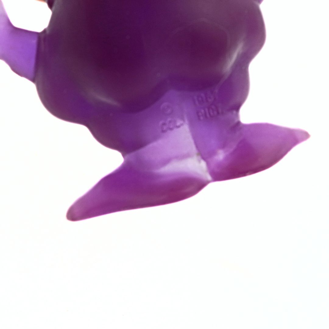 Close-up of a purple rubber duck on a white background