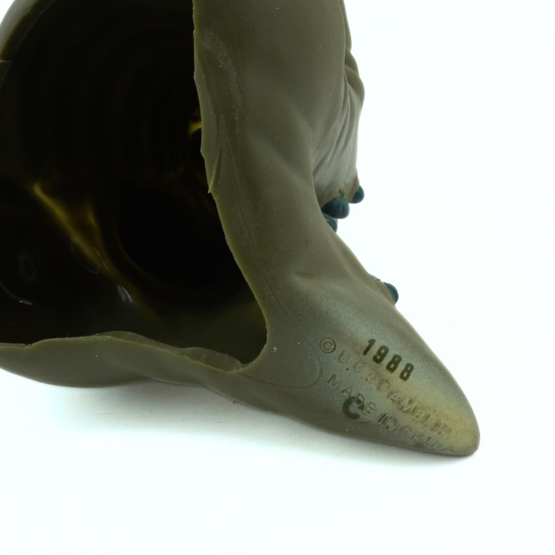 Close-up of a green tail with a white background