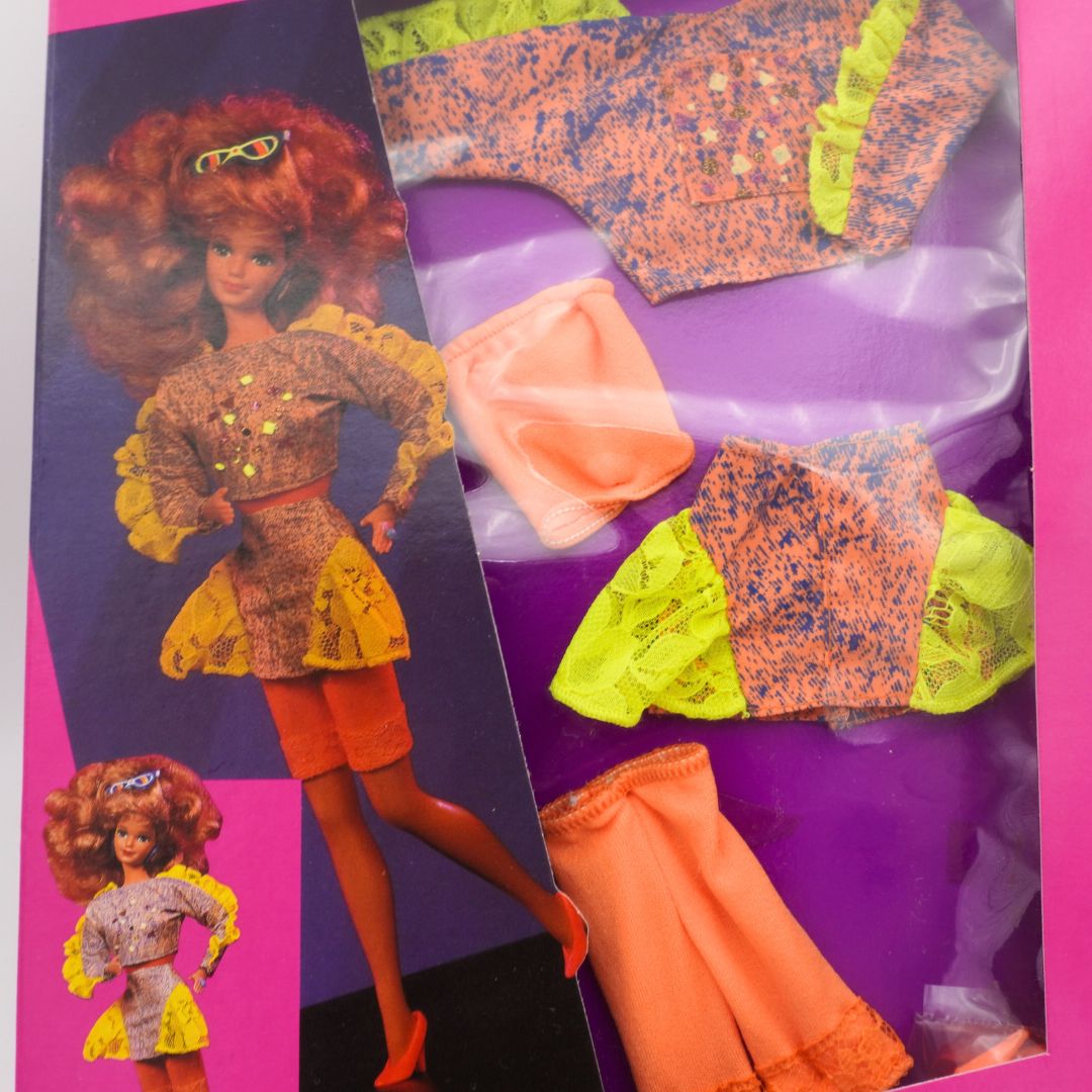 Barbie doll with outfits in a packaging display