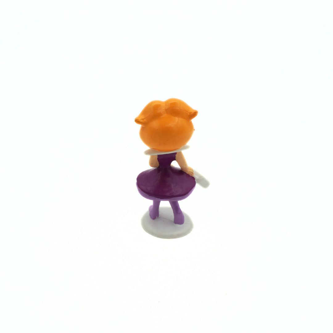 Back of a 1990 Jane Jetson figurine with a purple dress and white handbag