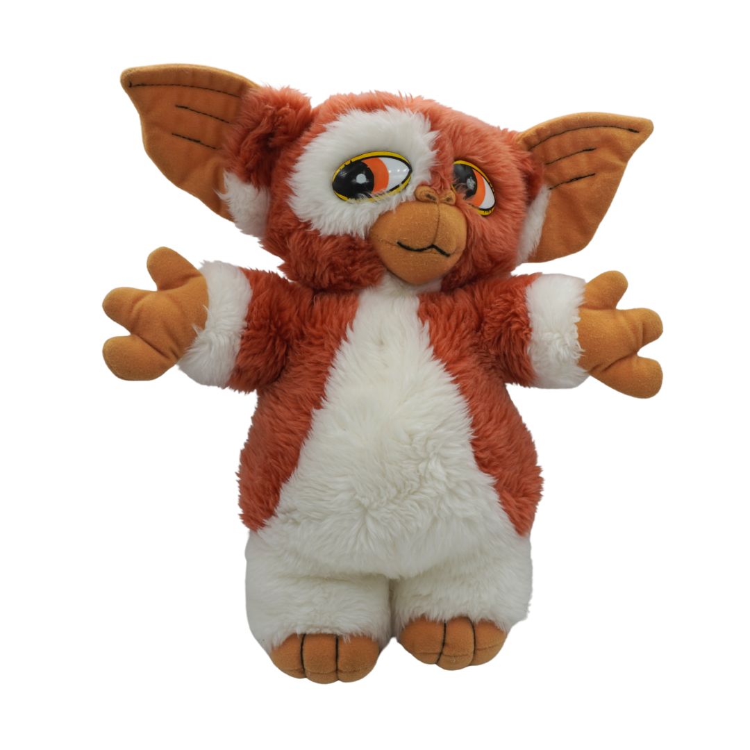 Plush toy resembling a character with orange and white fur on a white background