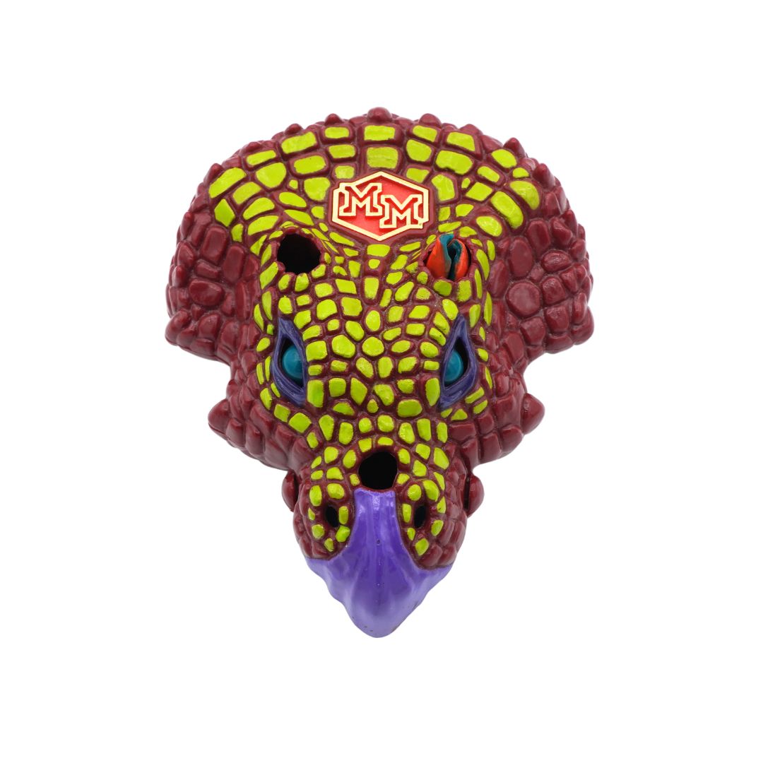 A red, green and purple Triceratops Mighty Max playset, photographed against a white background