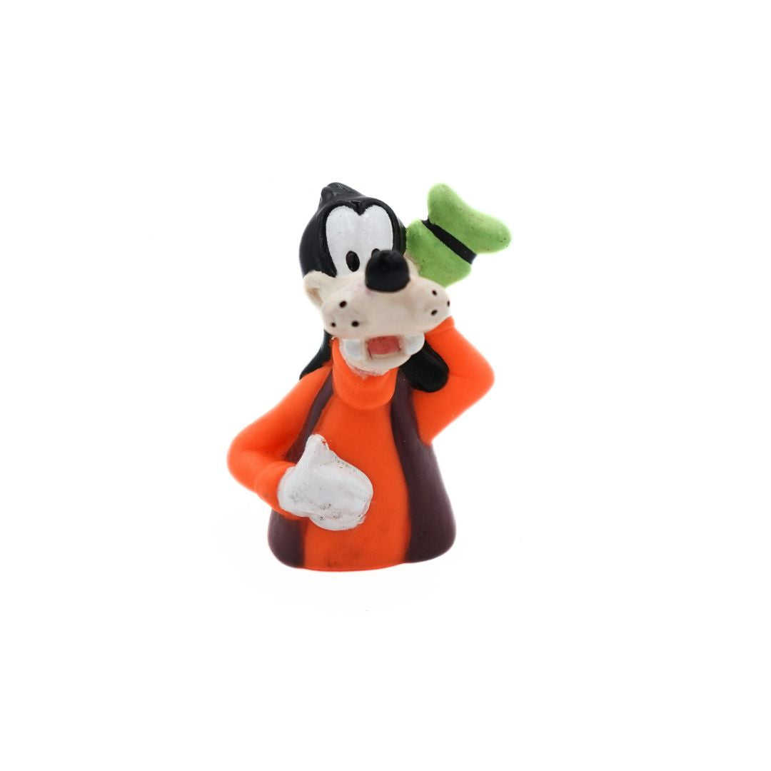 Photo of a 1994 Goofy figurine released as a Happy Meal toy wearing an orange and brown shirt with a green hat