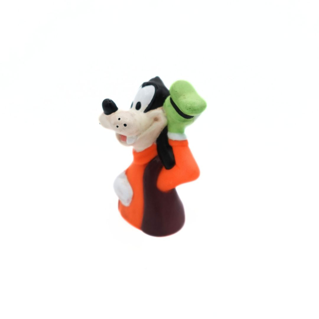 Photo of a 1994 Goofy figurine released as a Happy Meal toy wearing an orange and brown shirt with a green hat