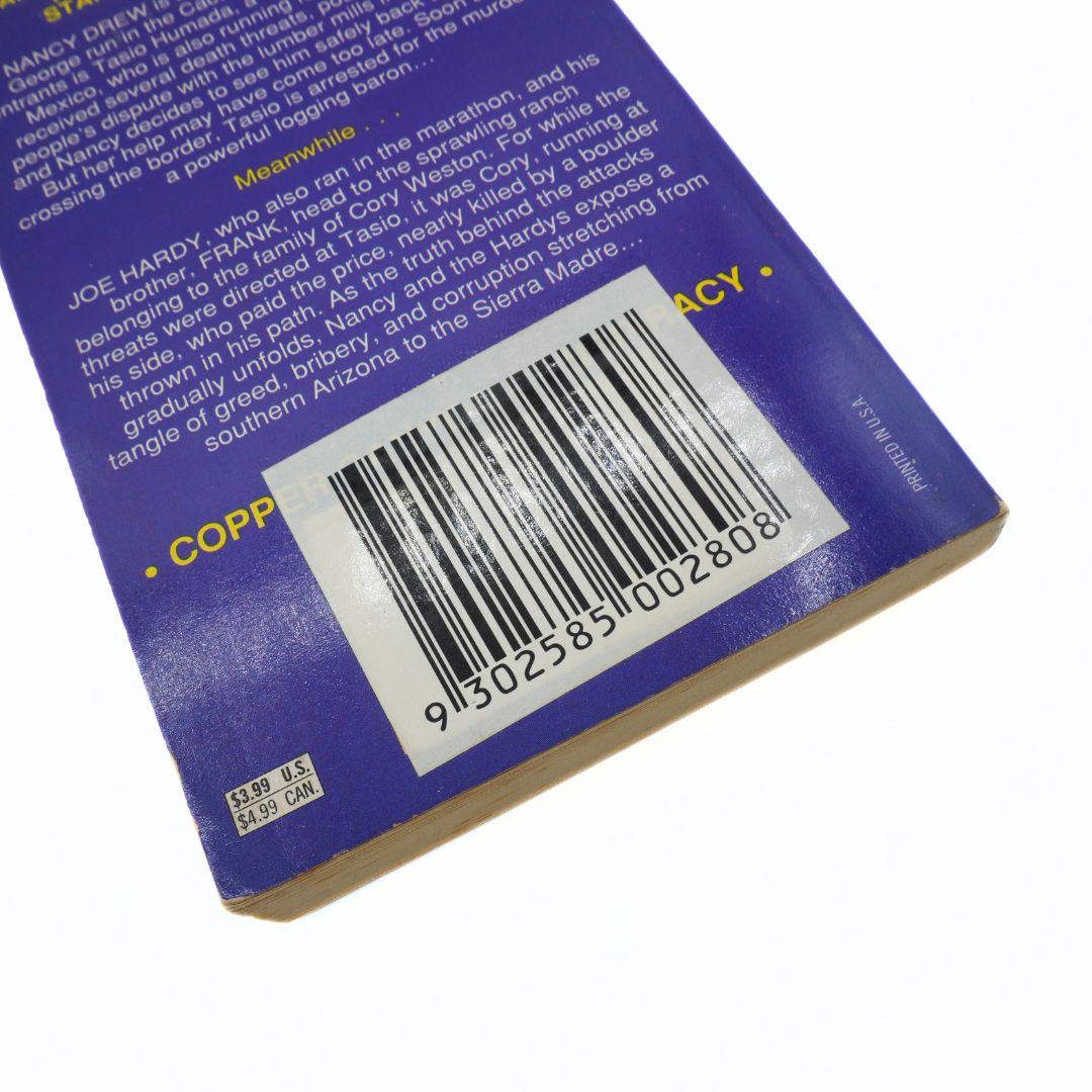 Close-up of a book back cover with a barcode and text