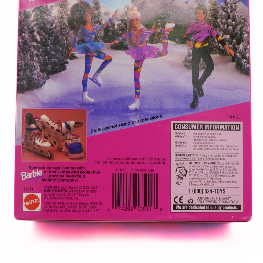 Barbie doll packaging with ice skating dolls and consumer information on a pink background