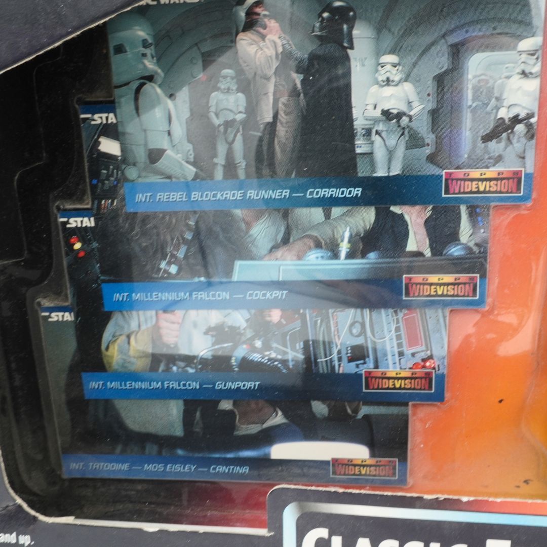 Star Wars action figures in packaging with character names on a black background
