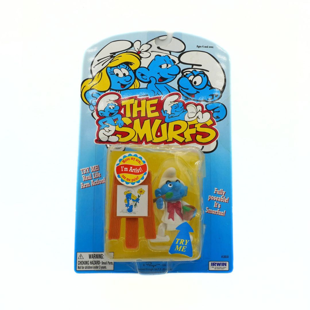 Packaged toy figure of a Smurf from 'The Smurfs' series on a white background