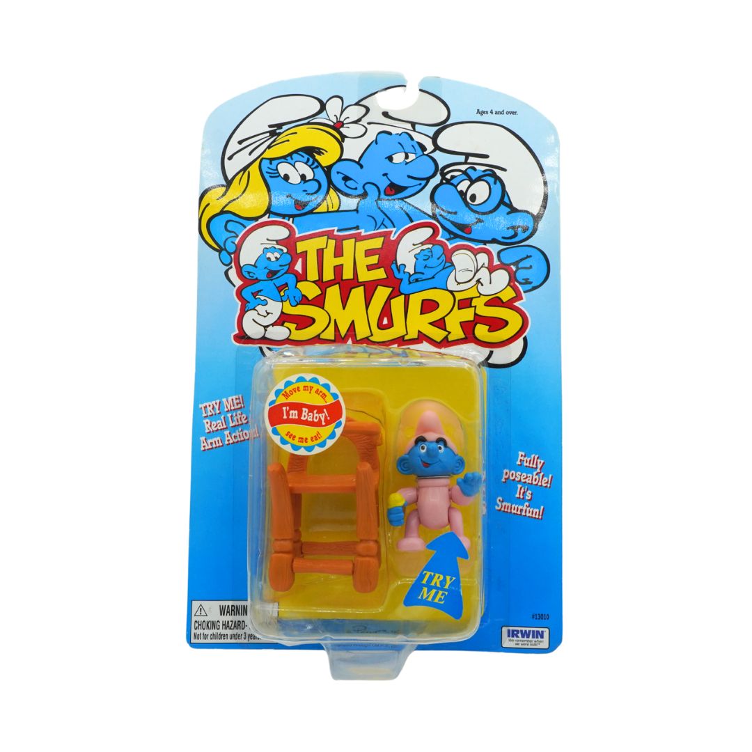 Toy figure in packaging with 'The Smurfs' branding on a white background