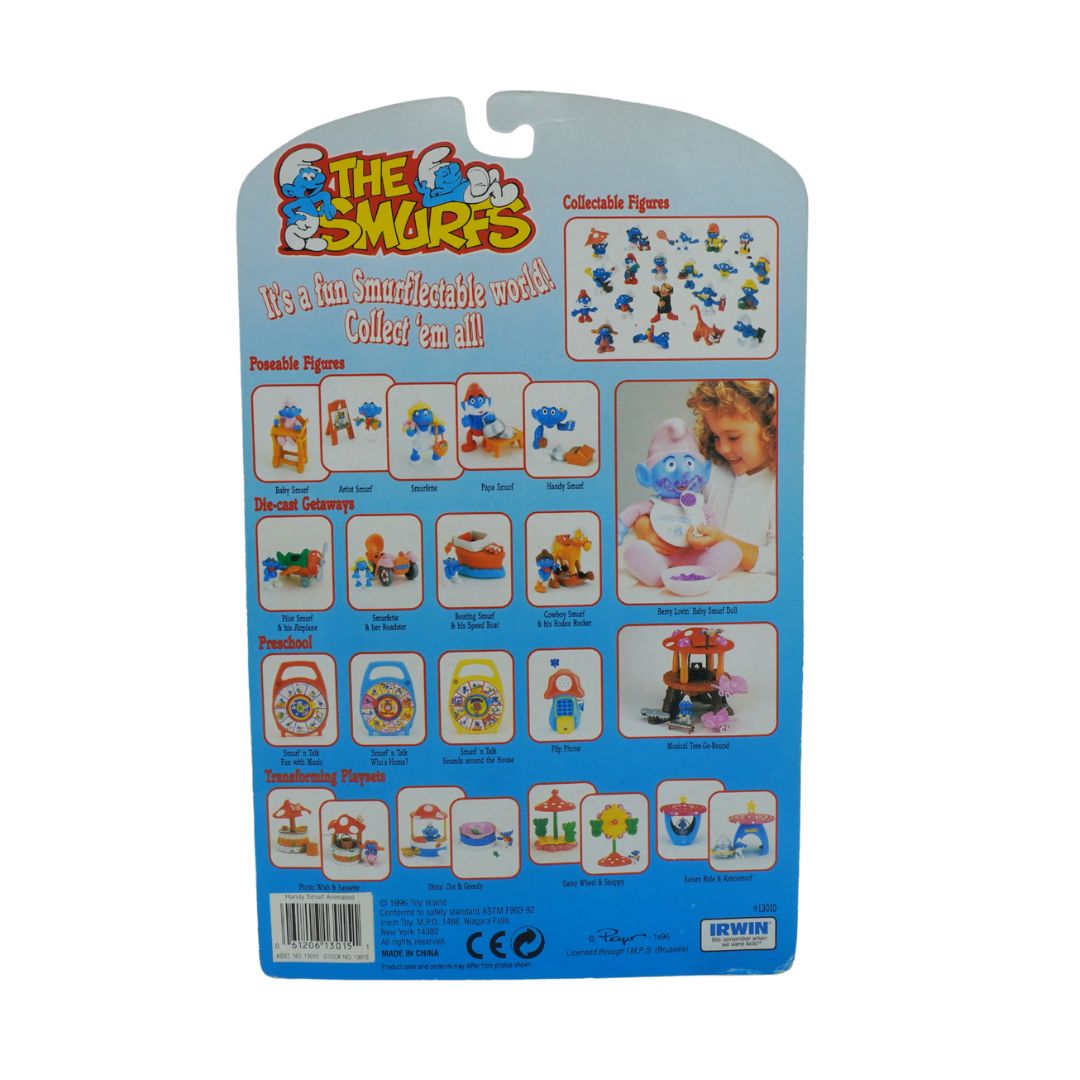 Packaging of Smurfs collectible figures with various Smurf illustrations on a blue background.