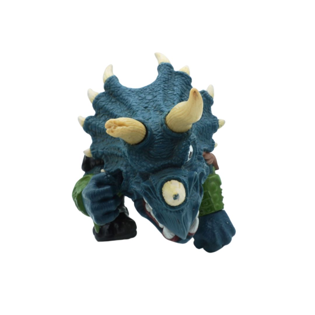 Toy dinosaur figure with blue body and yellow horns on a white background