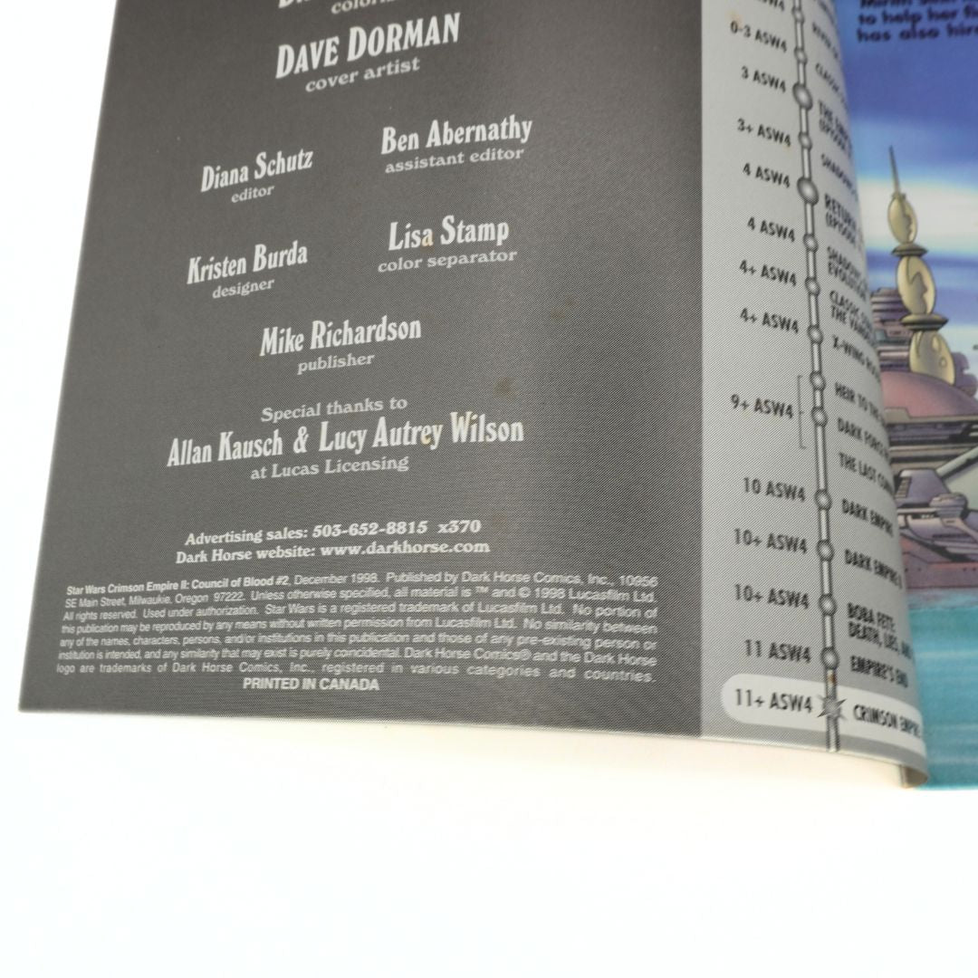 Back cover of a book with credits and a small illustration on the right side.