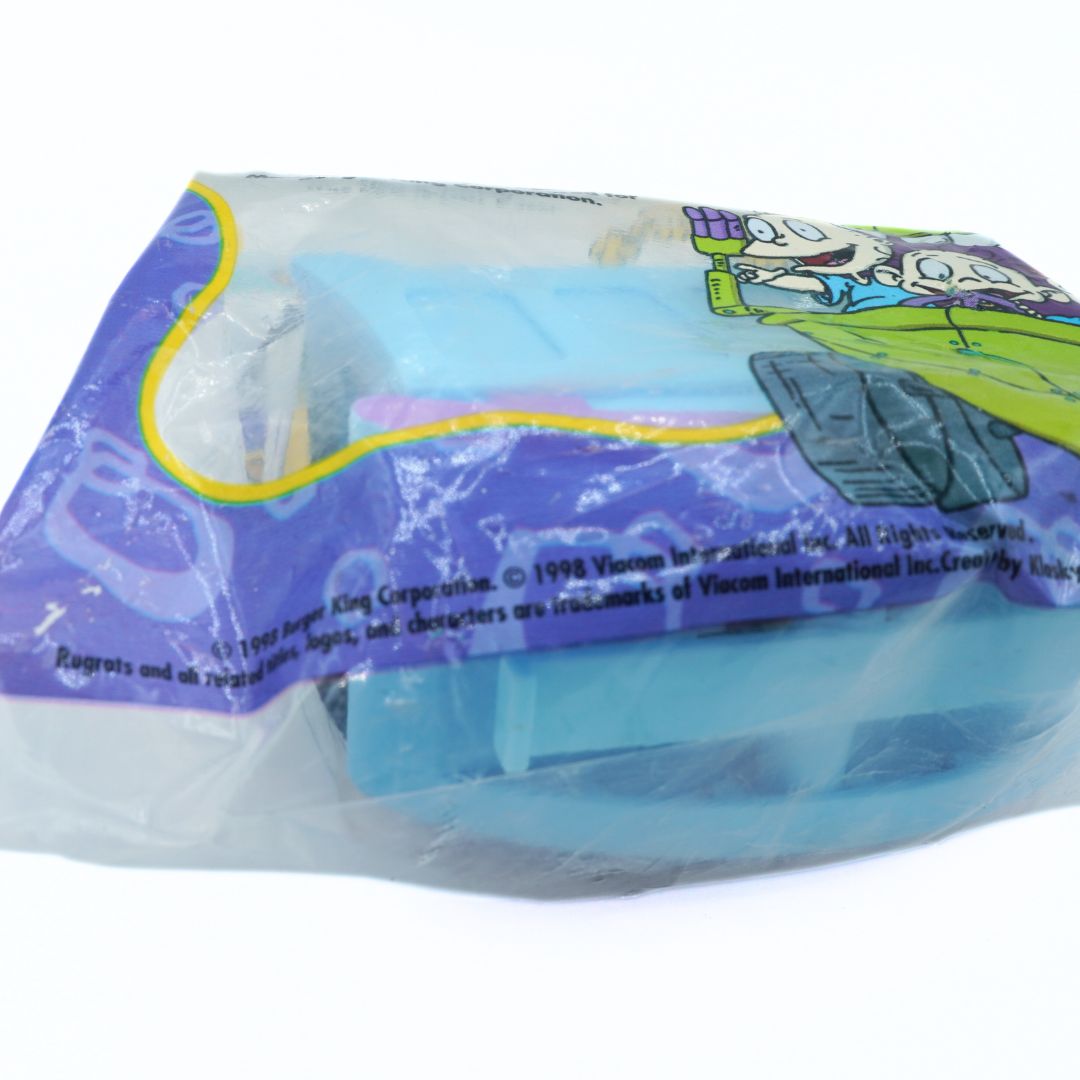 Toy figure in packaging with visible branding on a white background