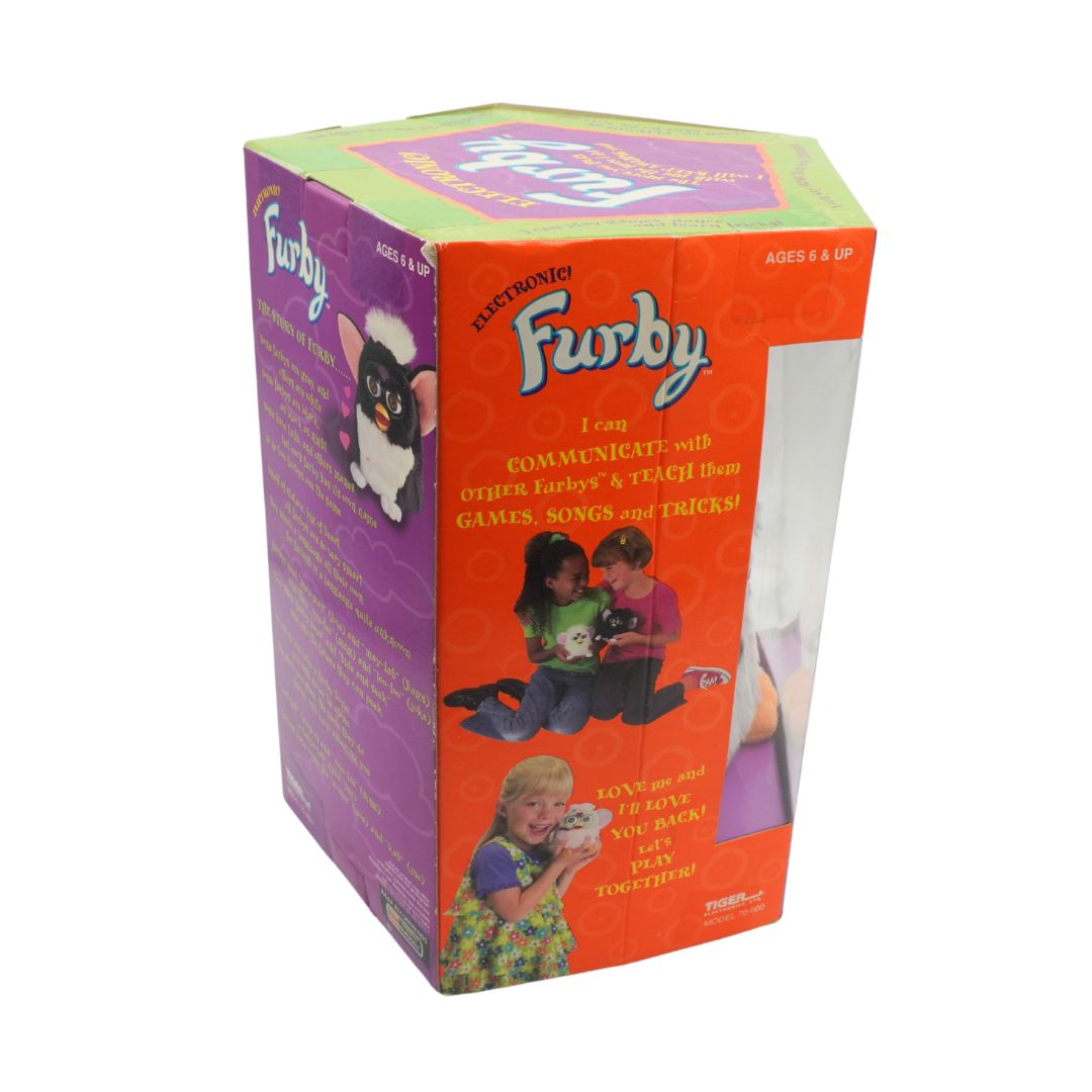 Box of a Furby electronic toy with colorful design and text.
