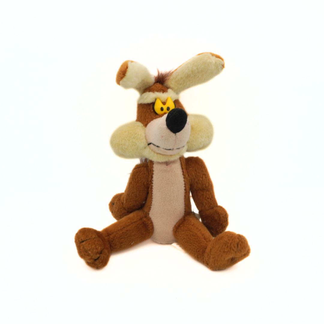 Plush toy resembling a cartoon character with brown and beige colors on a white background