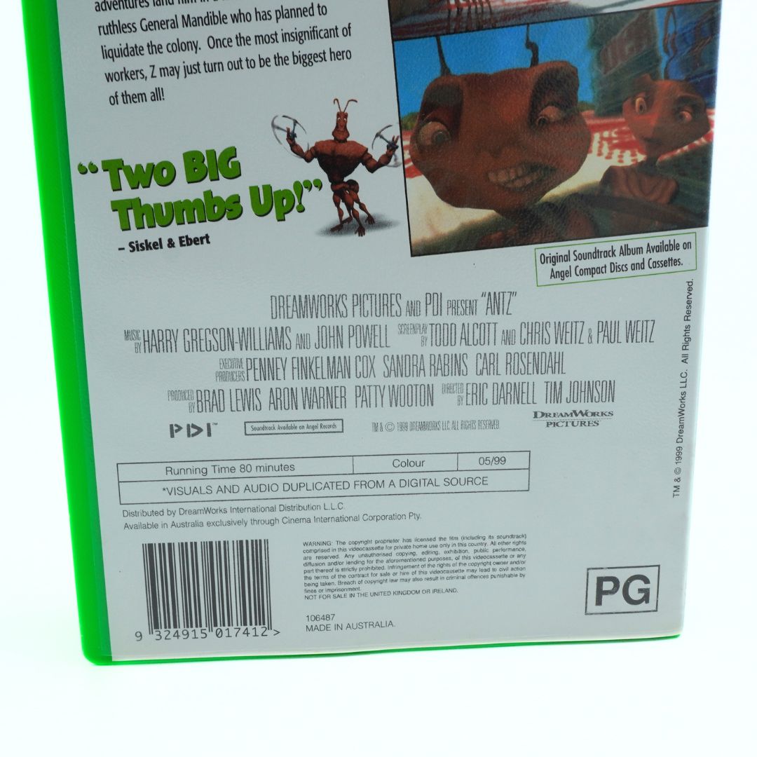 Back cover of a movie VHS case with text and graphics, featuring a cartoon character.