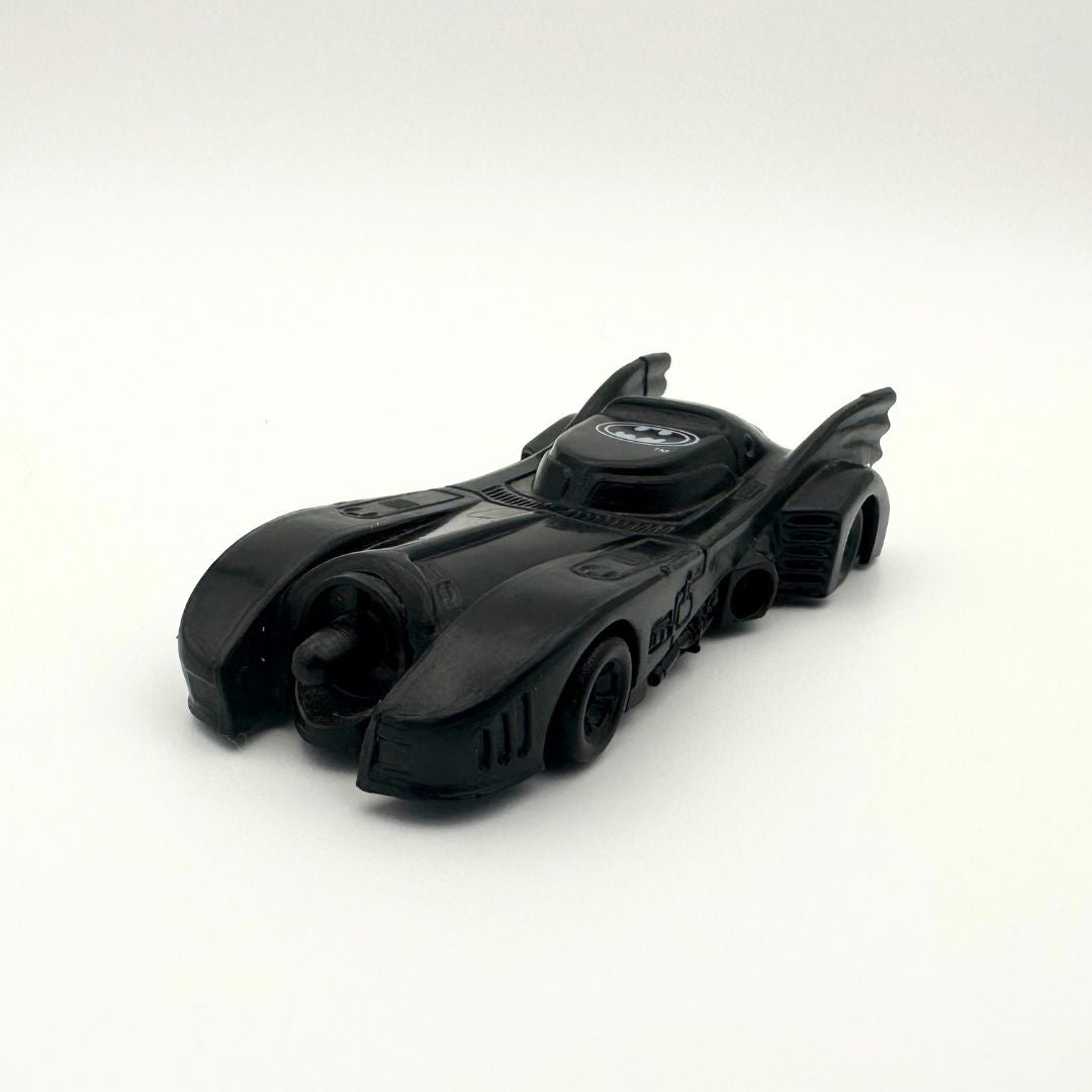 A slick black Batmobile toy