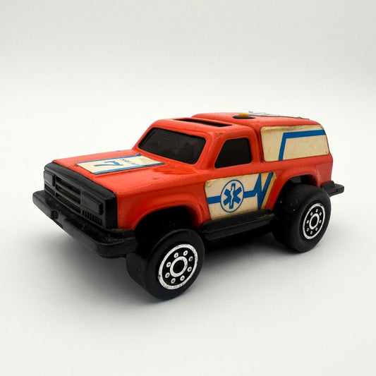 Orange ambulance die cast car