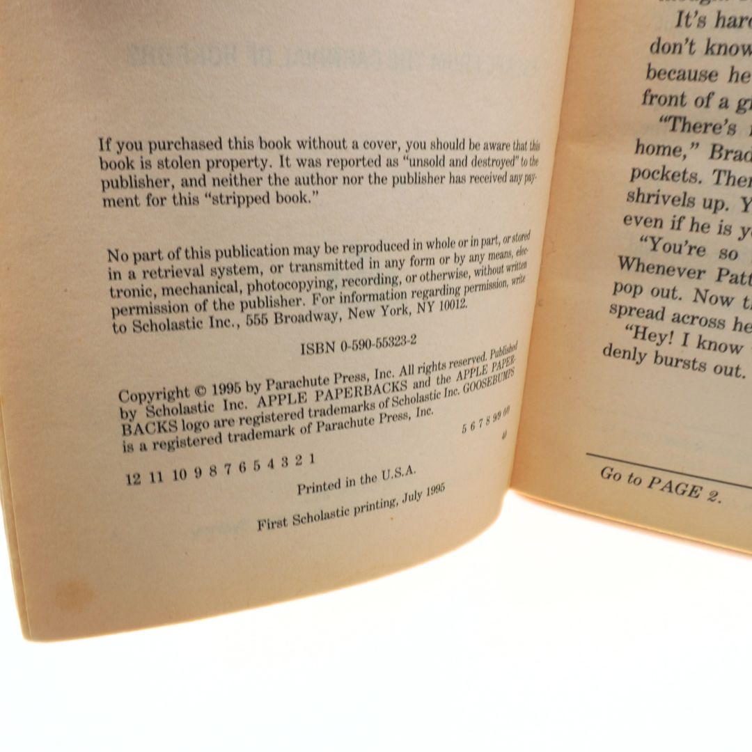 Open book with text and copyright information on a white background