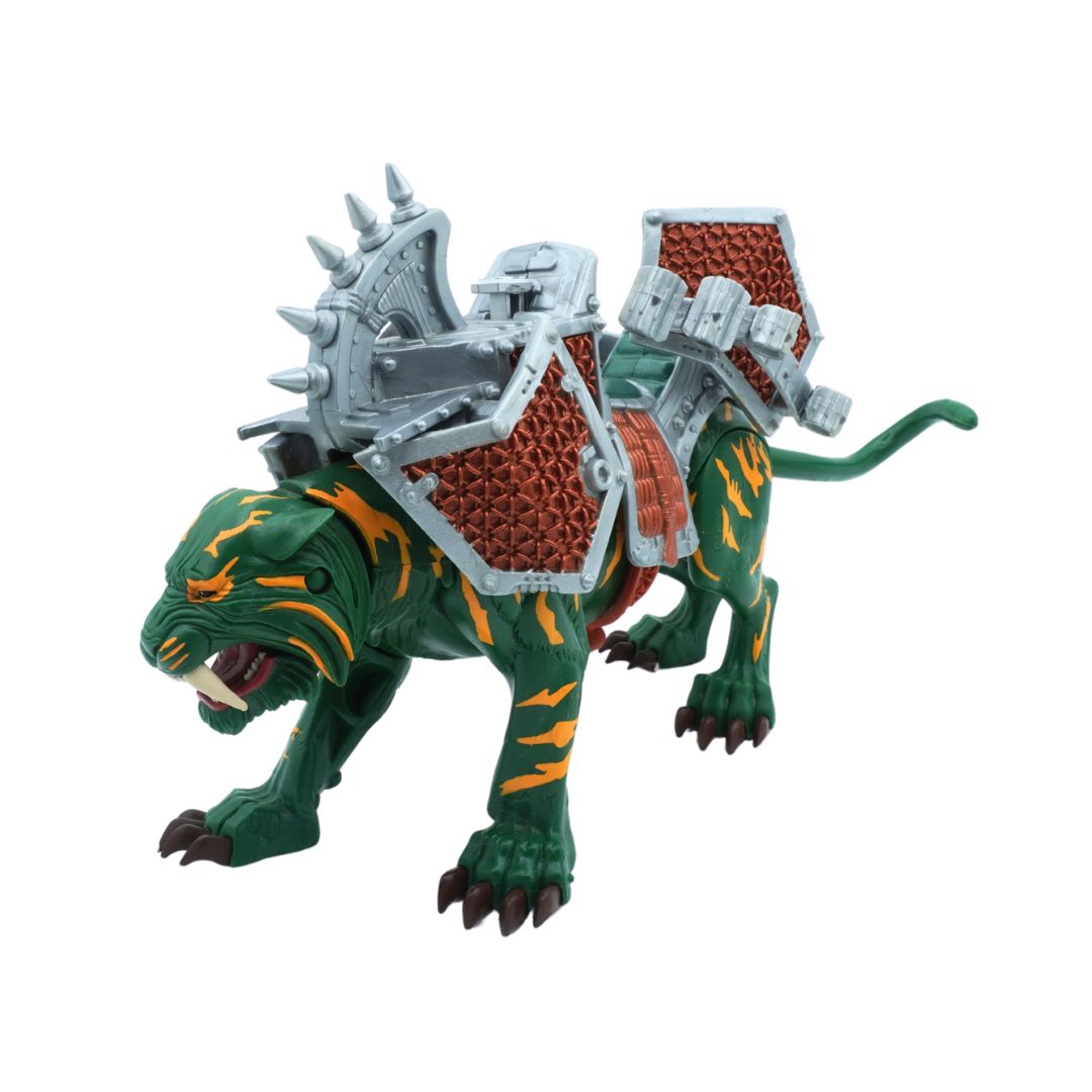 Toy figure of a green creature with armor on a white background